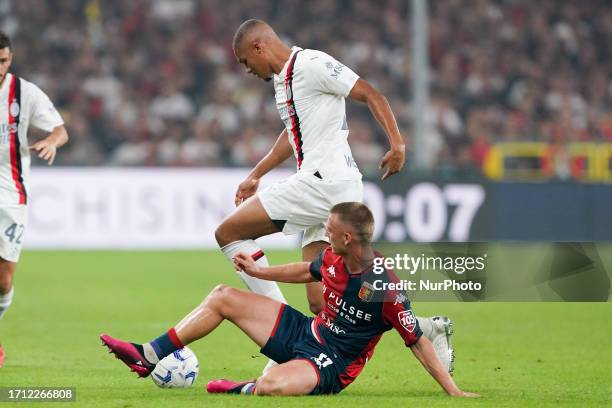 Malick Thiaw of AC Milan and Albert Gudmundsson of Genoa CFC compete for the ball during the Serie A Tim match between Genoa CFC and AC Milan at...