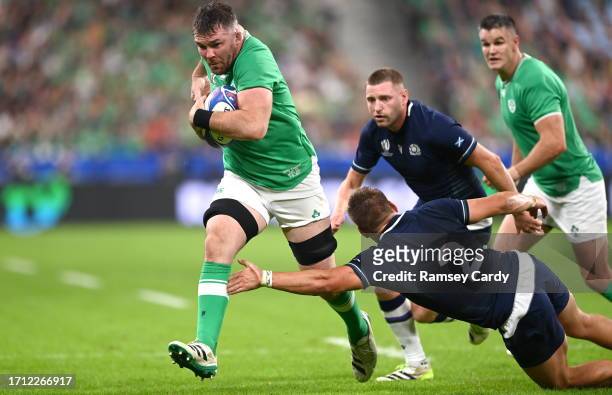 Paris , France - 7 October 2023; Peter O'Mahony of Ireland is tackled by George Turner of Scotland during the 2023 Rugby World Cup Pool B match...