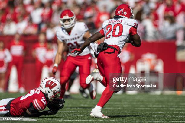 Rutgers Scarlet Knights running back Ja'shon Benjamin steps out of the tackle of Wisconsin Badgers corner back Jason Maitre durning a college...