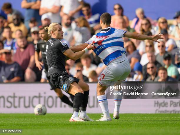 Blackburn Rovers' Arnor Sigurosson battles with Queens Park Rangers' Chris Willock during the Sky Bet Championship match between Queens Park Rangers...