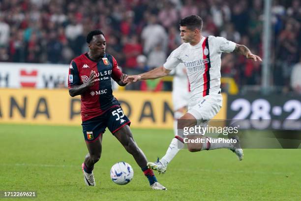 Ridgeciano Haps of Genoa CFC and Christian Pulisic of AC Milan compete for the ball during the Serie A Tim match between Genoa CFC and AC Milan at...