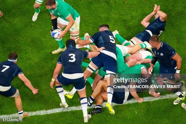 Ireland's lock Iain Henderson runs with the ball from a ruck during the France 2023 Rugby World Cup Pool B match between Ireland and Scotland at the...