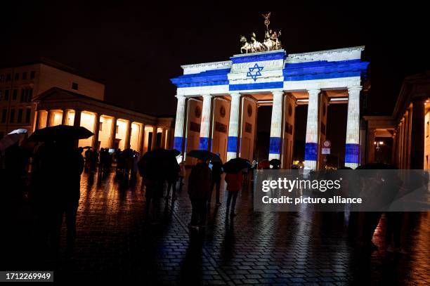 October 2023, Berlin: The Israeli flag will be projected onto the Brandenburg Gate on the sidelines of the Festival of Lights as a show of...