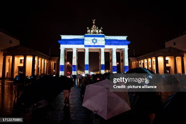 October 2023, Berlin: The Israeli flag will be projected onto the Brandenburg Gate on the sidelines of the Festival of Lights as a show of...