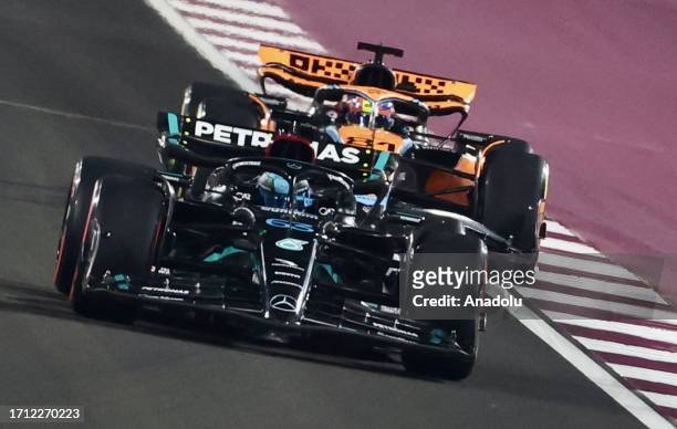 Oscar Piastri of McLaren and George Russell of Mercedes compete during the sprint race of the F1 Qatar Grand Prix at Losail Circuit in Doha, Qatar on...