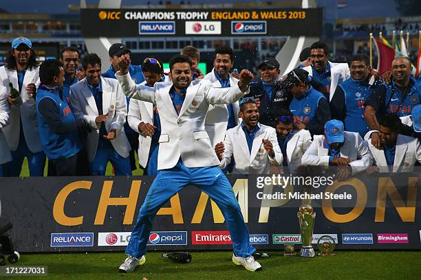 Virat Kohli of India dances in celebration during the victory ceremony following India's 5 run victory in the ICC Champions Trophy Final match...