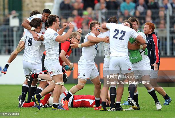 England players celebrate after winning the IRB Junior World Championship Final match between England U20 and Wales U20 at Stade de la Rabine on June...