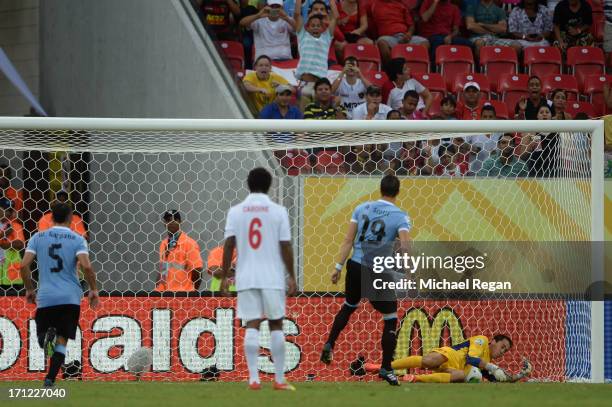 Gilbert Meriel of Tahiti makes the save on the penalty kick of Andres Scotti of Uruguay during the FIFA Confederations Cup Brazil 2013 Group B match...