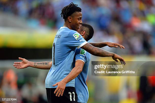 Abel Hernandez and Diego Perez of Uruguay celebrate after a goal during the FIFA Confederations Cup Brazil 2013 Group B match between Uruguay and...