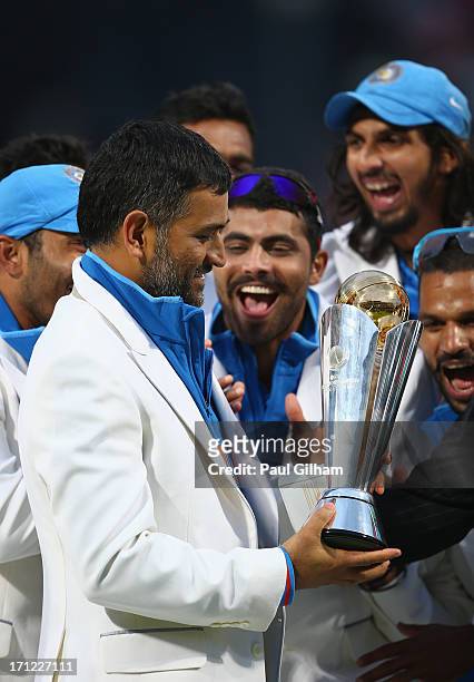 Dhoni of India is presented The ICC Champions Trophy after India beat England in the ICC Champions Trophy Final match between England and India at...