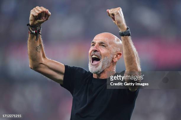 Stefano Pioli, head coach of Milan, celebrates after the Serie A TIM match between Genoa CFC and AC Milan at Stadio Luigi Ferraris on October 7, 2023...