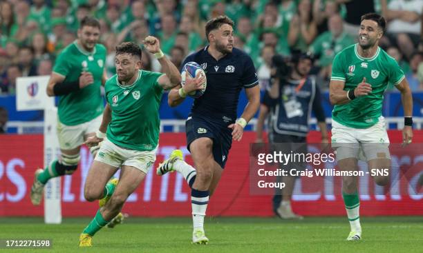 Scotland's Ollie Smith off loads the ball to Ali Price who scores the second Scotland try of the game during a Rugby World Cup match between Ireland...