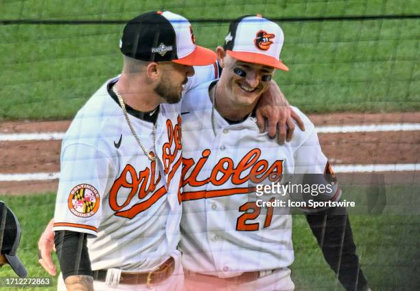 October 07: Baltimore Orioles left fielder Austin Hays gets a hug from relief pitcher DL Hall after his diving catch during game 1 of the American...