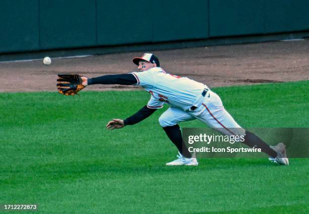 October 07: Baltimore Orioles left fielder Austin Hays makes a diving catch during game 1 of the American League Divisional Series between the Texas...
