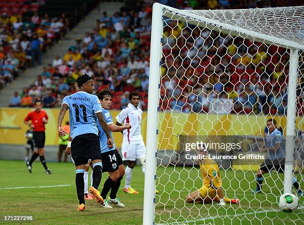 Nicolas Lodeiro of Uruguay scores a goal in the 61st minute against Gilbert Meriel of Tahiti during the FIFA Confederations Cup Brazil 2013 Group B...