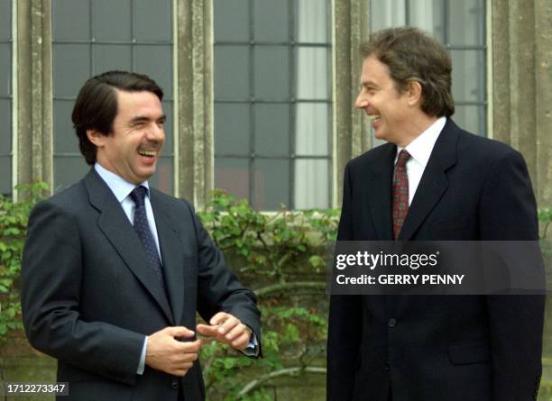 Spanish Prime Minister Jose Maria Aznar and British Prime Minister Tony Blair share a light hearted moment during a stroll in the rose garden of...