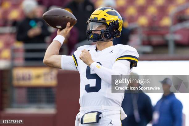 Michigan Wolverines quarterback J.J. McCarthy warms up before the college football game between the Michigan Wolverines and the Minnesota Golden...