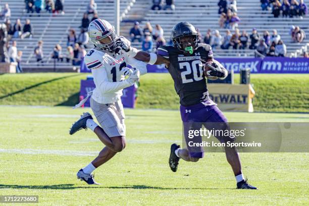 Northwestern Wildcats running back Joseph Himon II grabs the face mask of Howard Bison defensive back Jabari Knighten during the college football...