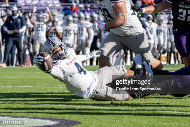 Howard Bison wide receiver Richie Ilarraza reaches towards the endzone for a touchdown while being brought down by Northwestern Wildcats defensive...