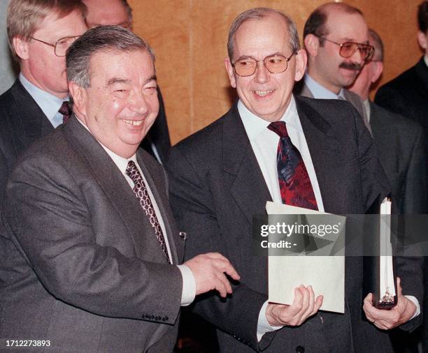 Russian Prime Minister Yevgeny Primakov and Michel Camdessus , Managing Director of the International Monetary Fund smile after their meeting in...