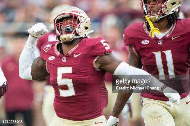 Defensive lineman Jared Verse of the Florida State Seminoles celebrates after a big play during the second half of their game against the Virginia...
