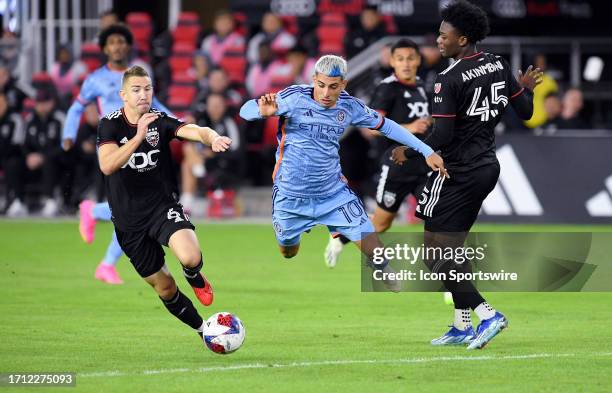New York City FC midfielder Santiago Rodriguez flies through the air after being fouled by DC United defender Matai Akinmboni during the New York...