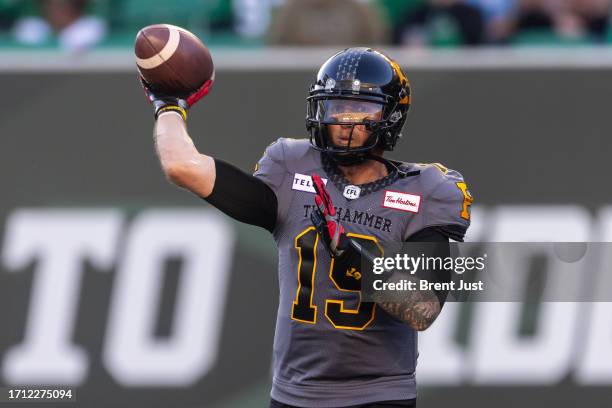 Bo Levi Mitchell of the Hamilton Tiger-Cats throws a pass in the first half of the game between the Hamilton Tiger-Cats and Saskatchewan Roughriders...