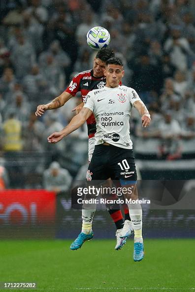 Ayrton Lucas of Flamengo heads the ball against Matias Rojas of