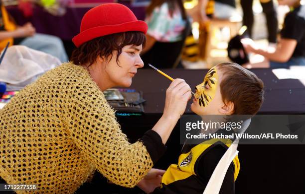 Young Tigers fan has their face painted during the 2023 AFLW Round 06 match between the Richmond Tigers and the Gold Coast SUNS at IKON Park on...