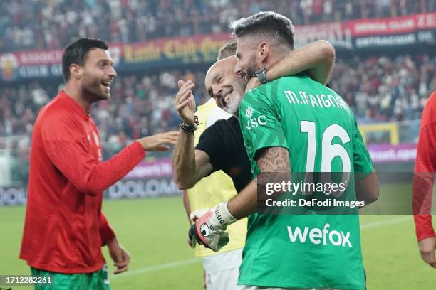 Olivier Giroud of AC Milan and Stefano Pioli head coach of AC Milan celebrate after winning the Serie A TIM match between Genoa CFC and AC Milan at...