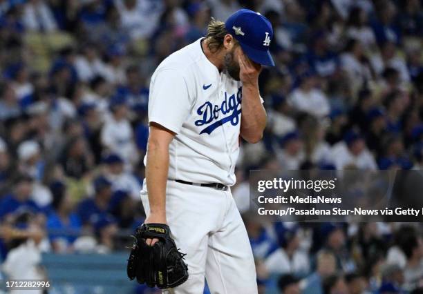 Los Angeles, CA Starting pitcher Clayton Kershaw of the Los Angeles Dodgers wipes his face after giving up a three home run to Gabriel Moreno of the...