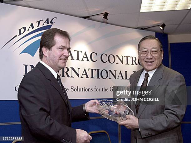 The Vice Premier of of the People's Republic of China, Li Lanqing is presented with an engraved Dublin Crystal bowl by Cyril Kerr, Chairman of Datac...