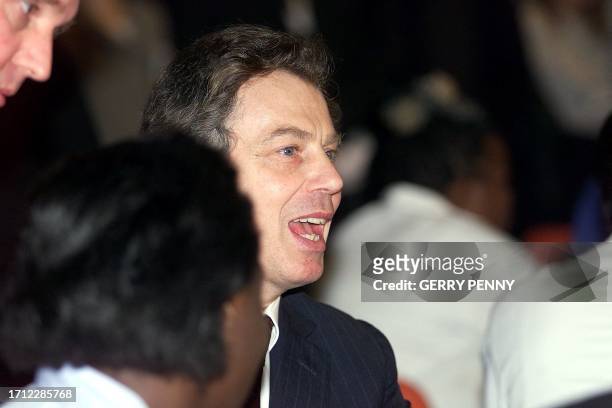 British Prime Minister Tony Blair talks with doctors and nurses at St. Thomas' Hospital 29 February 2000 after opening a one million pound upgraded...