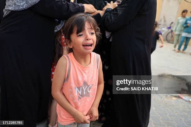 Child reacts during the funeral of members of the Abu Quta family who were killed in Israeli strikes on the Palestinian city of Rafah in the southern...