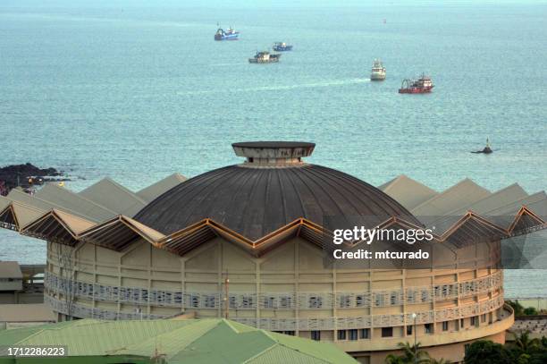 mohammed v palace (aka palais des nations) and the sea, conakry, guinea - guinea stock pictures, royalty-free photos & images