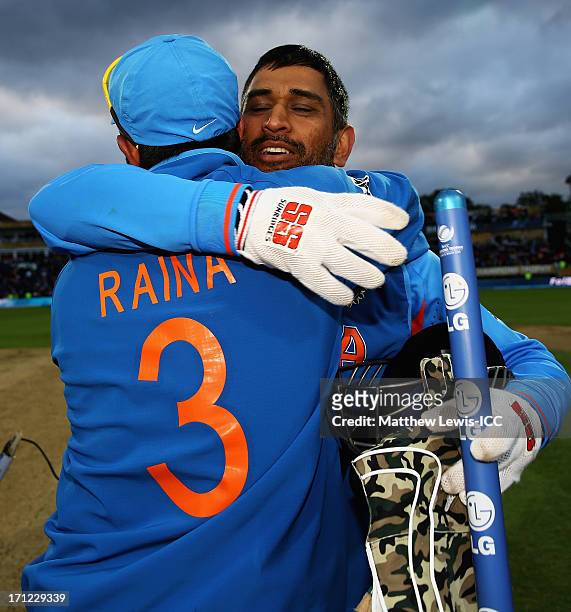 Dhoni, Captain of India celebrates with Suresh Raina afyer their win over England during the ICC Champions Trophy Final between England and India at...
