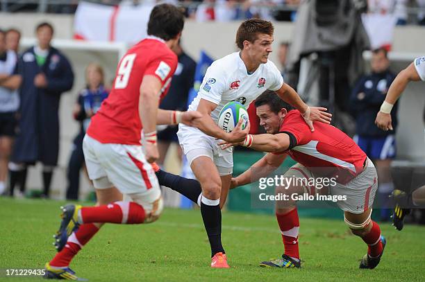 Henry Slade of England tries to break through the Welsh defence during the 2013 IRB Junior World Championship Final match between England and Wales...