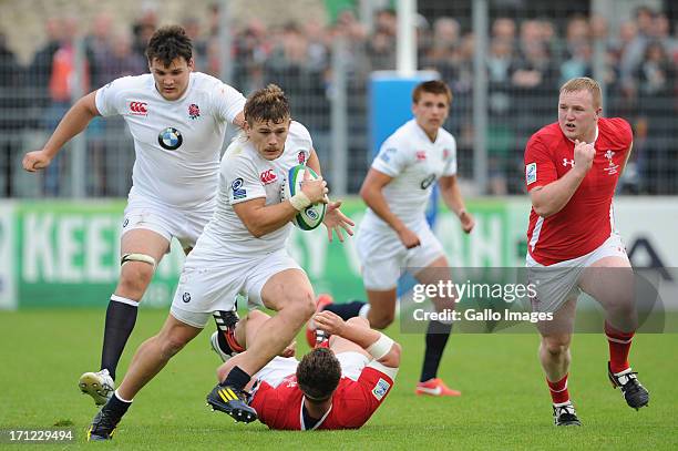 Luke Cowan-Dickie of England looks to make a break during the 2013 IRB Junior World Championship Final match between England and Wales at Stade de la...