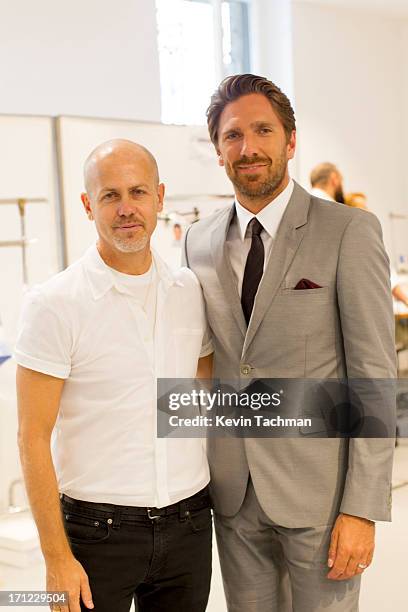 Designer Italo Zucchelli , left, and Henrik Lundqvist attend the Calvin Klein Collection show during Milan Menswear Fashion Week Spring Summer 2014...