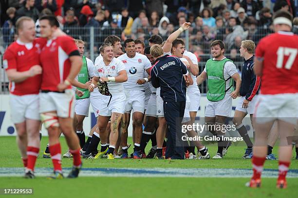 England players celebrate victory after the 2013 IRB Junior World Championship Final match between England and Wales at Stade de la Rabine on June...