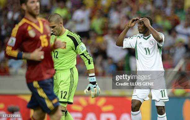Nigeria's forward Muhammad Gambo gestures after missing a goal opportunity against Spain during their FIFA Confederations Cup Brazil 2013 Group B...