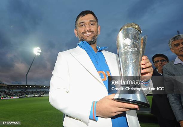 Dhoni of India poses with the Champions Trophy after their victory after the ICC Champions Trophy Final match between England and India at Edgbaston...