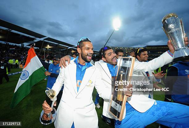 Shikhar Dhawan and Ravindra Jadeja of India celebrate their victory with their player awards and the Champions Trophy after the ICC Champions Trophy...