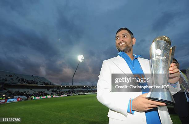 Dhoni of India poses with the Champions Trophy after their victory after the ICC Champions Trophy Final match between England and India at Edgbaston...