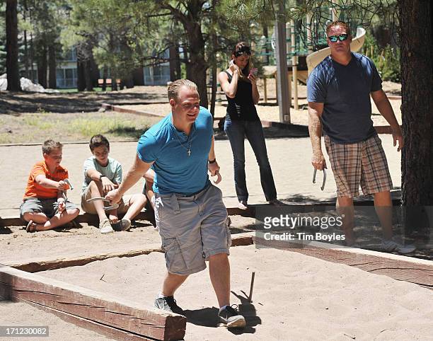 Nik Wallenda plays horseshoes with his family and friends in the hours before his historic highwire walk over the Grand Canyon June 23, 2013 in...