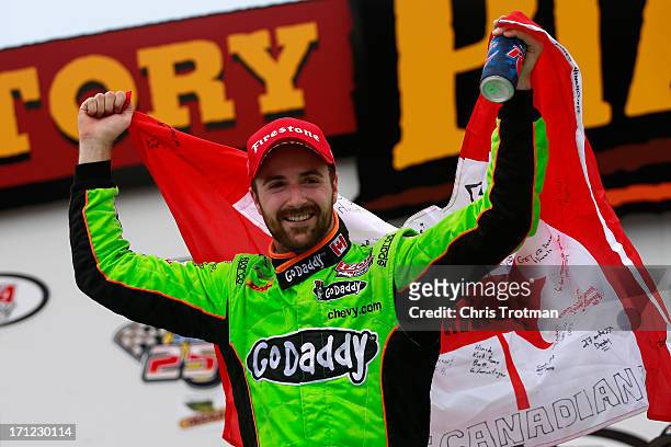 James Hinchcliffe of Canada driver of the GoDaddy Andretti Autosport Chevrolet celebrates in victory lane following his victory in the Iowa Corn Indy...