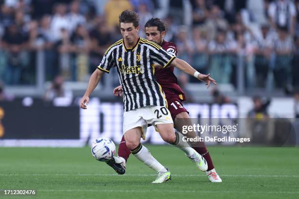 Fabio Miretti of Juventus Fc and Ricardo Rodriguez of Torino Fc battle for the ball during the Serie A TIM match between Juventus and Torino FC on...