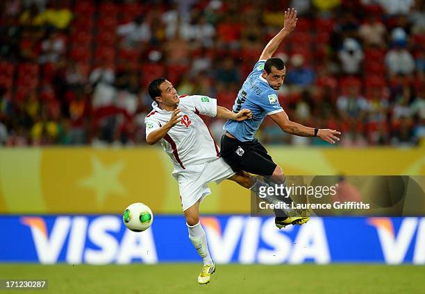 Edson Lemaire of Tahiti fights for the ball against Matias Aguirregaray of Uruguay during the FIFA Confederations Cup Brazil 2013 Group B match...