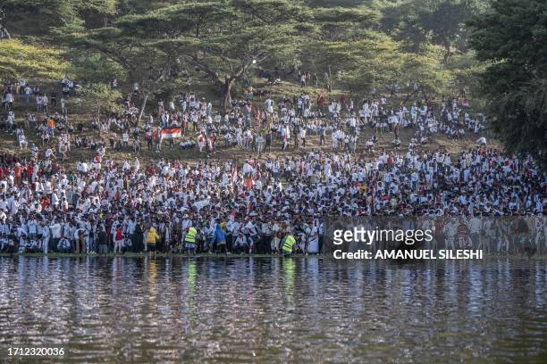 Oromo people gather on the shores of lake Hora Arsadi during the celebration of "Irreecha", the Oromo people thanksgiving holiday in Bishoftu,...
