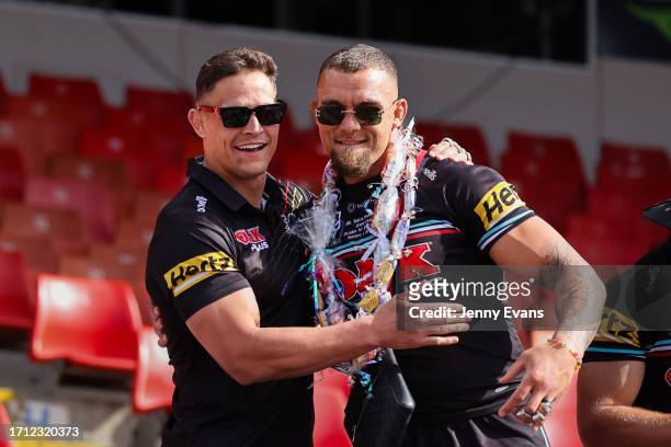 Scott Sorensen of the Panthers and James Fisher-Harris of the Panthers greet fans during the 2023 NRL Grand Final at BlueBet Stadium on October 02,...